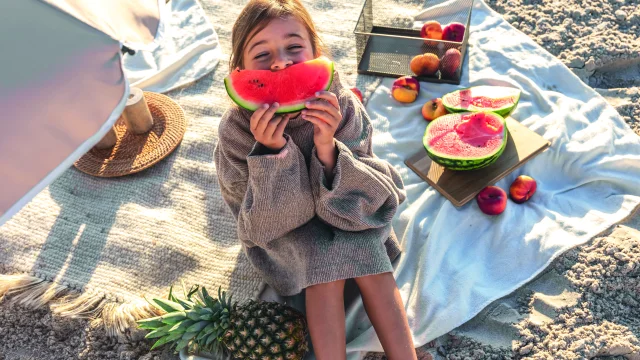 Little Girl Beach Sand Eats Pasteque Freepik 1