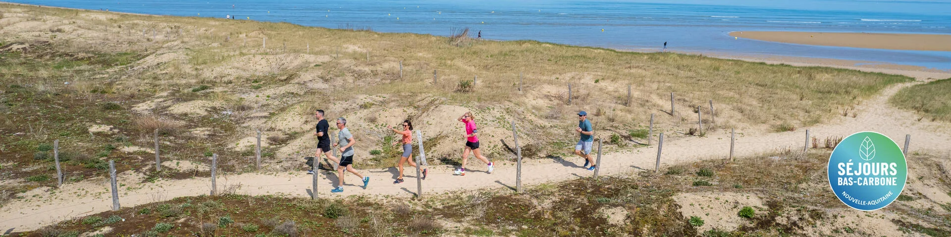 People Running On A Path Near The Beach