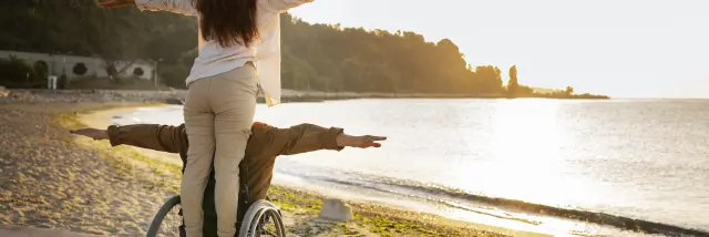 full-shot-disabled-man-woman-vacation.jpg